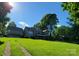 Lovely traditional home with a lush green lawn, offering a serene and inviting curb appeal at 221 Stillwater Rd, Troutman, NC 28166