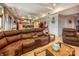 Basement living room featuring a large sectional sofa, tile floors and a bar area with seating and ping pong at 2580 Penngate Dr, Sherrills Ford, NC 28673
