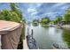 Waterfront dock with boat lift and jet ski cover on a cloudy day at 2580 Penngate Dr, Sherrills Ford, NC 28673