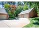 Spacious driveway leading to a brick home with a 3-car garage and well-maintained landscaping at 2580 Penngate Dr, Sherrills Ford, NC 28673