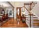 Inviting foyer with hardwood floors, a staircase, and an elegant front door with decorative glass at 2580 Penngate Dr, Sherrills Ford, NC 28673