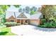 Beautiful single-Gathering home featuring a brick facade, mature landscaping, and an attached two-car garage at 2580 Penngate Dr, Sherrills Ford, NC 28673