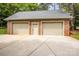 Three-car garage with brick facade and neutral doors offers ample parking and storage space at 2580 Penngate Dr, Sherrills Ford, NC 28673