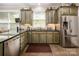Charming kitchen with stainless steel appliances, granite countertop and tiled flooring at 2580 Penngate Dr, Sherrills Ford, NC 28673