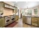 Spacious kitchen features custom cabinetry, stainless steel appliances, and granite countertops at 2580 Penngate Dr, Sherrills Ford, NC 28673