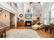 Open-concept living room with vaulted ceilings, a fireplace, hardwood floors, and ample natural light at 2580 Penngate Dr, Sherrills Ford, NC 28673