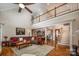 Spacious living area featuring hardwood floors, a staircase, and a view into the dining area at 2580 Penngate Dr, Sherrills Ford, NC 28673