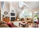 Comfortable living room with a fireplace, large windows, and hardwood flooring creating a warm ambiance at 2580 Penngate Dr, Sherrills Ford, NC 28673