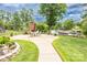 Outdoor patio with a brick fireplace, ample seating, and serene views of the lake at 2580 Penngate Dr, Sherrills Ford, NC 28673