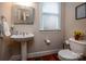 Charming powder room with hardwood floors at 2580 Penngate Dr, Sherrills Ford, NC 28673