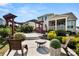Landscaped backyard with a patio, pergola, lush plants, outdoor seating, and a tranquil ambiance at 2830 Berkhamstead Cir, Concord, NC 28027