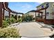 Well-manicured backyard with a patio, pergola, lush plants, and ample space for recreation at 2830 Berkhamstead Cir, Concord, NC 28027