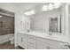 Bathroom with a dual sink vanity, lots of cabinet space, and a separate room housing the commode and shower at 2830 Berkhamstead Cir, Concord, NC 28027