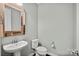 Charming powder room with a vessel sink, modern faucet, stylish mirror, and a low-consumption toilet at 2830 Berkhamstead Cir, Concord, NC 28027