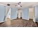 Bedroom boasts hardwood floors, a ceiling fan, with easy access to an ensuite bathroom and a walk-in closet at 2830 Berkhamstead Cir, Concord, NC 28027