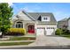 Charming home featuring a gray roof, three car garage, and well-maintained landscaping at 2830 Berkhamstead Cir, Concord, NC 28027