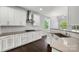 Bright kitchen boasts white cabinetry and stainless steel hood, backsplash, and a garden view window at 2830 Berkhamstead Cir, Concord, NC 28027