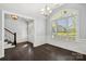 Elegant room with dark wood floors, white trim, and large arched window with abundant natural light at 2830 Berkhamstead Cir, Concord, NC 28027