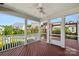 Inviting covered patio with a ceiling fan and views of the backyard and neighborhood at 2830 Berkhamstead Cir, Concord, NC 28027