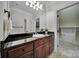 Bathroom featuring a granite countertop and a doorway leading to a walk-in closet with white shelving at 298 Horton Grove Rd, Fort Mill, SC 29715