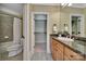 Bathroom with granite countertops, wooden cabinets, and a shower at 298 Horton Grove Rd, Fort Mill, SC 29715