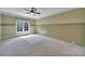 A bedroom with wall to wall carpet, a ceiling fan, and windows at 298 Horton Grove Rd, Fort Mill, SC 29715