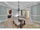 Dining room with chandelier, wainscoting, and hardwood floors at 298 Horton Grove Rd, Fort Mill, SC 29715