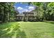 Expansive green lawn of luxury home with manicured landscaping and mature trees at 298 Horton Grove Rd, Fort Mill, SC 29715