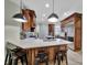 Spacious kitchen island with stainless appliances, white countertops, and dark barstools at 298 Horton Grove Rd, Fort Mill, SC 29715