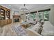 Spacious living room with fireplace, built-ins, and large windows at 298 Horton Grove Rd, Fort Mill, SC 29715