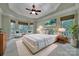 A bright and airy main bedroom features a tray ceiling, large windows and beautiful décor at 298 Horton Grove Rd, Fort Mill, SC 29715