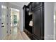 Mudroom featuring black cabinets and a door leading to the laundry room at 298 Horton Grove Rd, Fort Mill, SC 29715