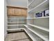 Walk-in pantry with custom shelving and a cabinet at 298 Horton Grove Rd, Fort Mill, SC 29715