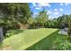 Well-kept backyard featuring a wooden fence, lush green grass, and ample space for outdoor activities at 300 Hidden Cove Ln, Matthews, NC 28104