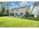 Expansive backyard featuring a pergola, green lawn, and tasteful landscaping for outdoor enjoyment at 300 Hidden Cove Ln, Matthews, NC 28104