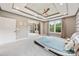 Bedroom with modern platform bed, tray ceiling, and access to additional rooms at 300 Hidden Cove Ln, Matthews, NC 28104