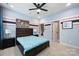 A bedroom with custom wall paint, carpet, ceiling fan, and a window for ample natural light at 300 Hidden Cove Ln, Matthews, NC 28104