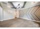 Dining room featuring decorative wall design, tray ceiling, and hardwood floors at 300 Hidden Cove Ln, Matthews, NC 28104