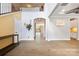 Foyer with hardwood floors, staircase, arched doorway, and modern decor at 300 Hidden Cove Ln, Matthews, NC 28104