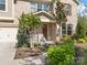 Charming brick home featuring a manicured front yard, beautiful landscaping, and an inviting front door entrance at 300 Hidden Cove Ln, Matthews, NC 28104