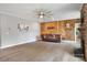 Comfortable living room with a fireplace, wood accent wall, and open layout, ideal for relaxation at 300 Hidden Cove Ln, Matthews, NC 28104