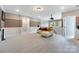A spacious living room with neutral paint, carpet, recessed lighting, and a media niche at 300 Hidden Cove Ln, Matthews, NC 28104