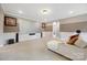 Large living room with carpet, projector screen and comfortable seating at 300 Hidden Cove Ln, Matthews, NC 28104