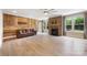 Spacious living room featuring stone fireplace, wood accent wall, and ample natural light at 300 Hidden Cove Ln, Matthews, NC 28104
