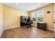 Bright office space with hardwood floors, large windows, and ample desk space at 300 Hidden Cove Ln, Matthews, NC 28104