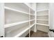 Well-organized walk-in pantry with ample shelving, offering plenty of storage space at 300 Hidden Cove Ln, Matthews, NC 28104