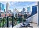 Relaxing balcony featuring comfortable seating and a stunning city skyline view, perfect for enjoying the outdoors at 300 W 5Th St # 644, Charlotte, NC 28202