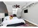 Bedroom featuring unique architecture, a large window, and a comfortable bed with decorative pillows and comforter at 300 W 5Th St # 644, Charlotte, NC 28202