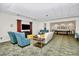 Community room with sofas, chairs, side tables, flower arrangement, large tv, and pool table at 300 W 5Th St # 644, Charlotte, NC 28202