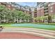 Relaxing courtyard with a putting green, lush landscaping, and brick pathway winding throughout the community at 300 W 5Th St # 644, Charlotte, NC 28202